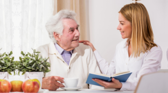 caregiver reading some books to patient