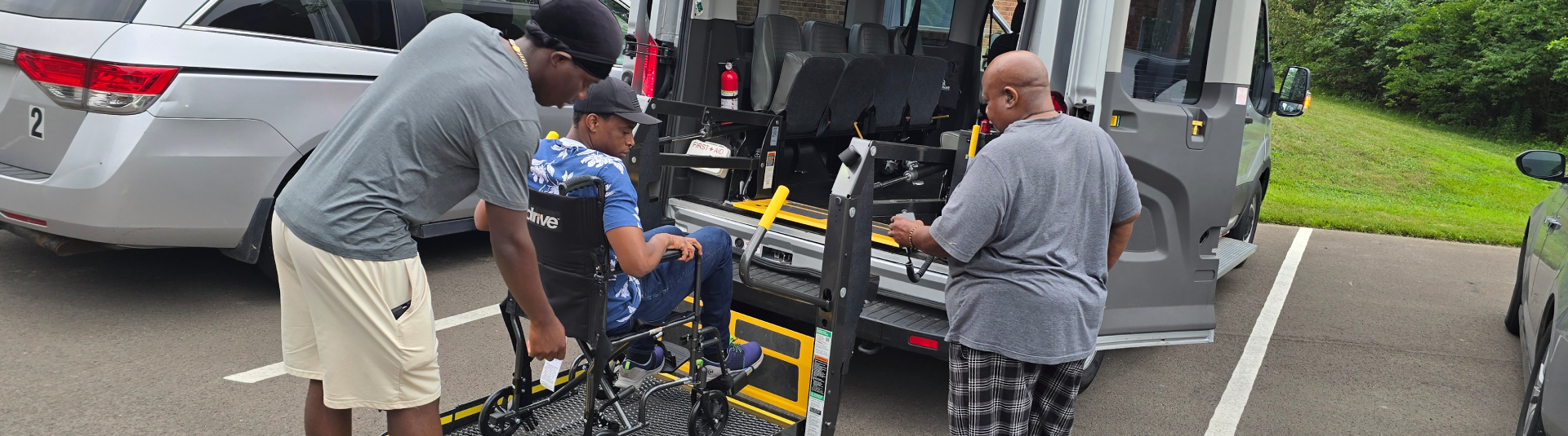 Wheelchair bound young man entering the van